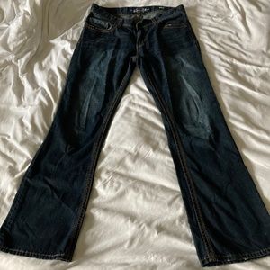 Seven7 dark wash bootcut jeans with rivet pocket detail